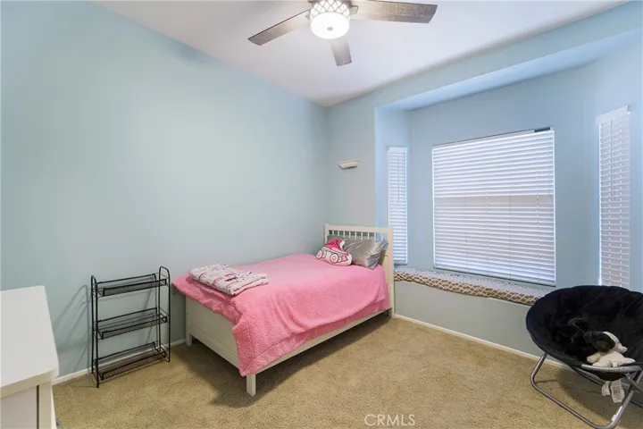 One of the secondary bedrooms with lovely sitting area.