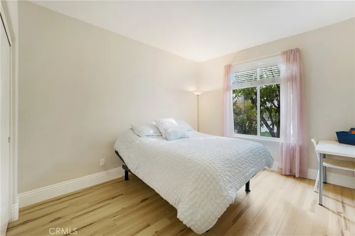 The downstairs bedroom boasts views out to the backyard.