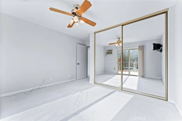 Upstairs bedroom #2 has mirrored closet doors.