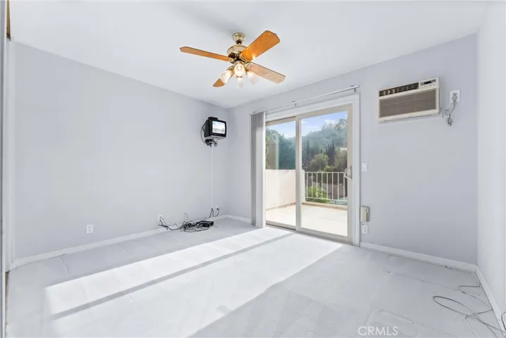 Upstairs bedroom #2 with balcony access.