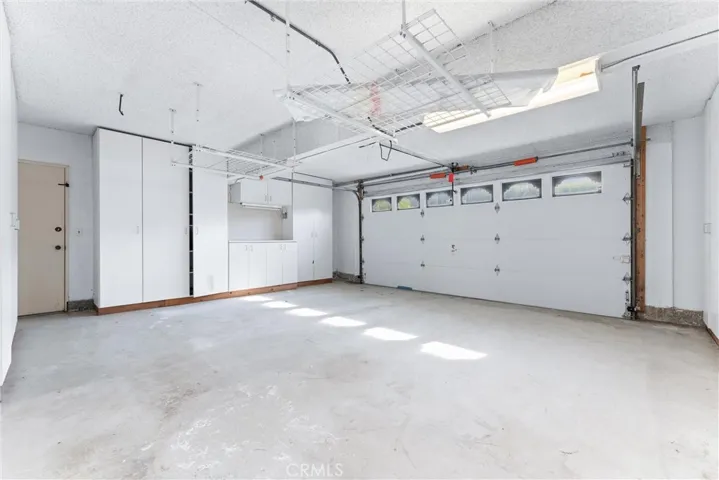 Garage storage closets on all three sides.