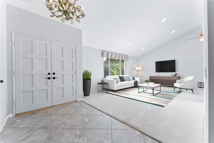 Living room is digitally staged.