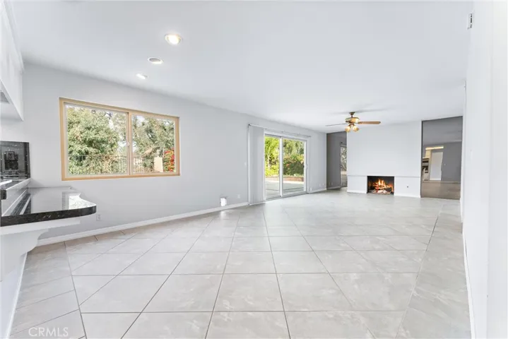 Downstairs family room with fireplace.