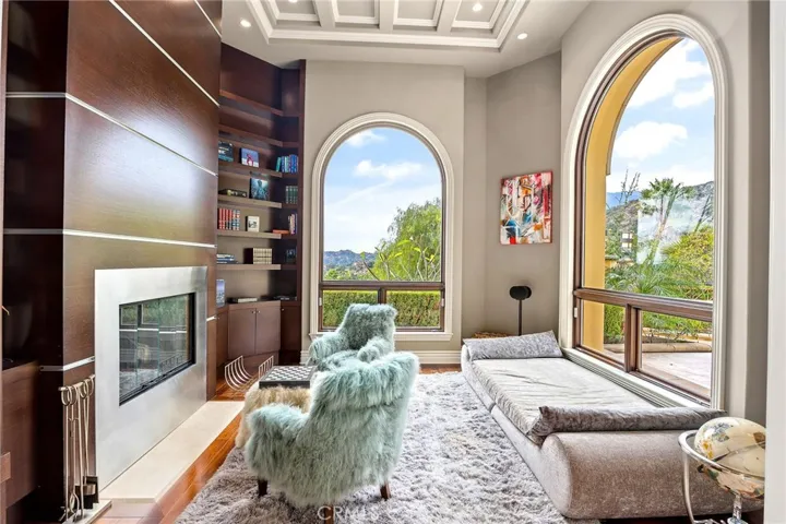 Cozy Library with incredible views, a fireplace & tall detailed ceilings