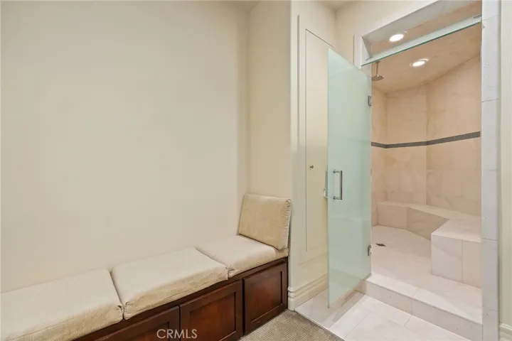 Spa Sized steam shower located in the gym. There is also a powder room in the gym.