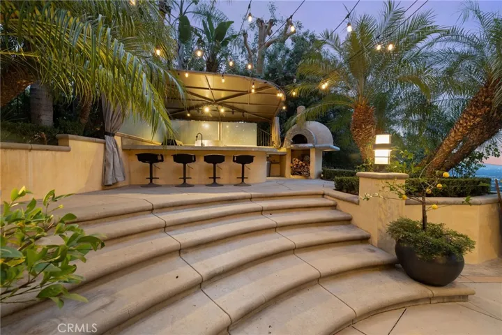 Stairs up to the outdoor kitchen