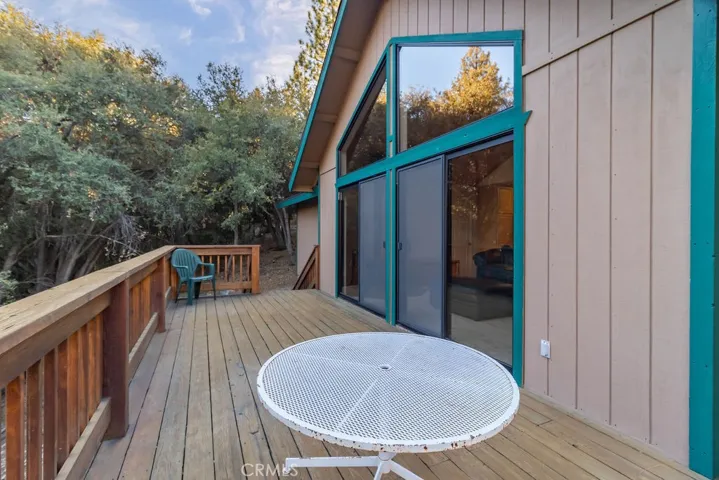 The rear deck offers outdoor living accessed from the living room and the primary bedroom.