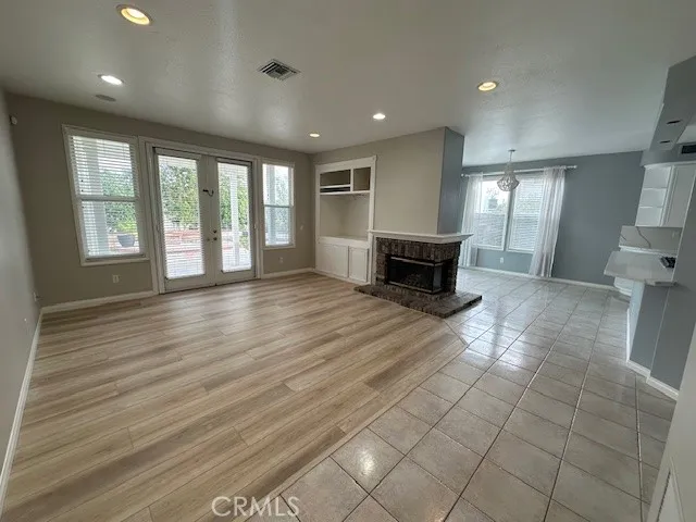 Family Room open to the Kitchen w Fireplace