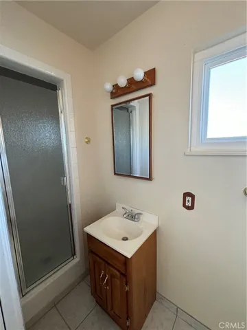 Bathroom with shower near the kitchen & garage