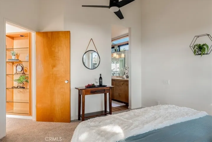 View showing entrance to primary bathroom and door to living room on left.