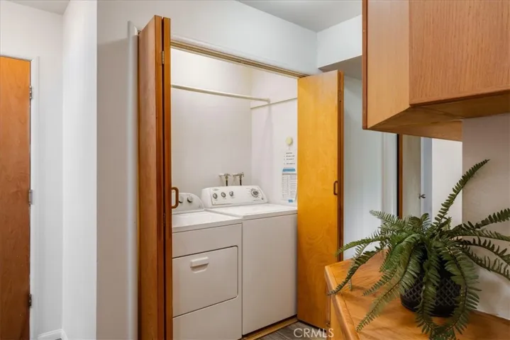 Washer and dryer in hallway downstairs.