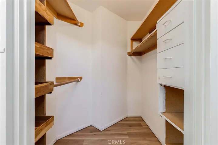 Walk in closet for primary bedroom.