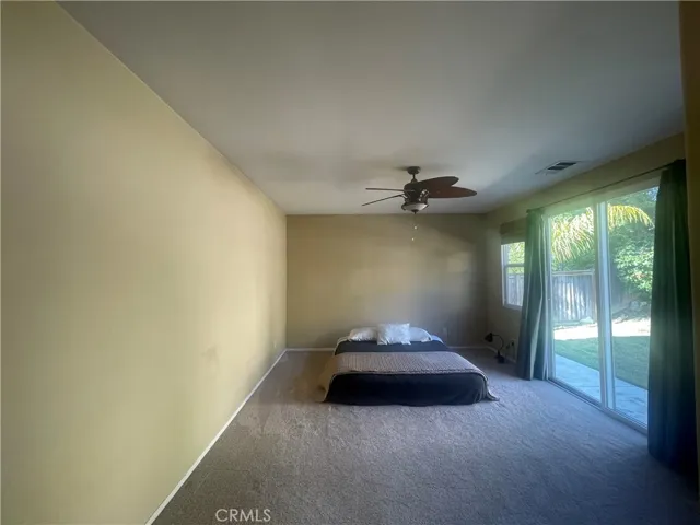 Primary Bedroom retreat w/ nice slider into yard