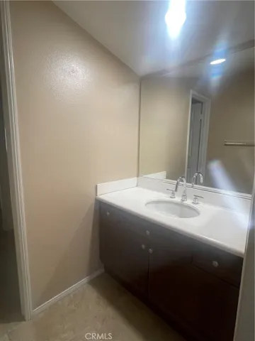 Seperate sinks on both sides of this bathroom