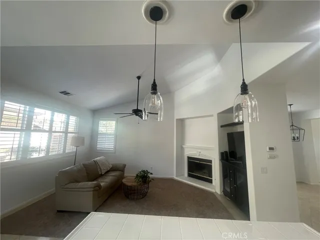 Sitting area with carpet and fireplace