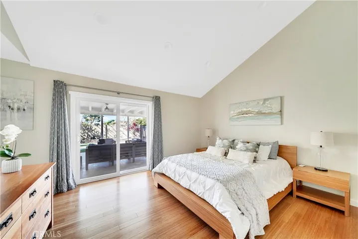 Master Bedroom With Vaulted Ceilings and Bamboo Flooring