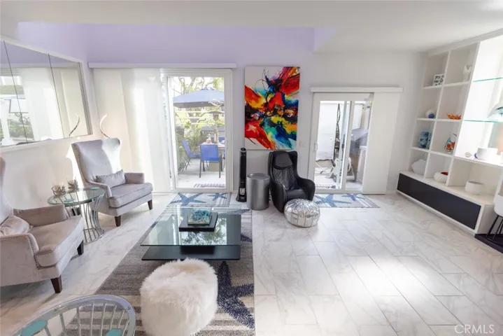 living room leads out to  deck & greenbelt