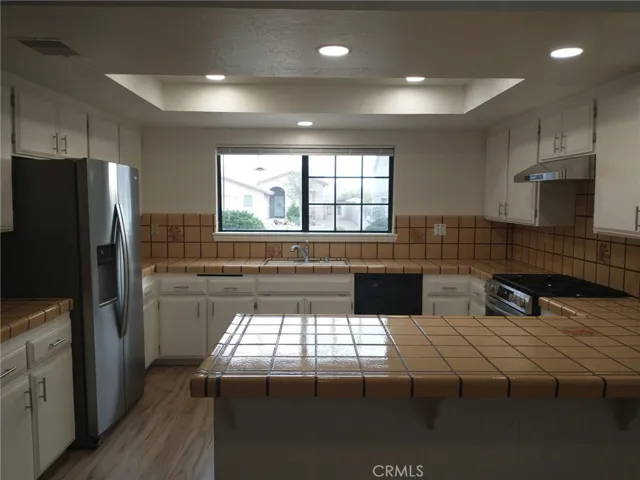 Kitchen view with window blinds up