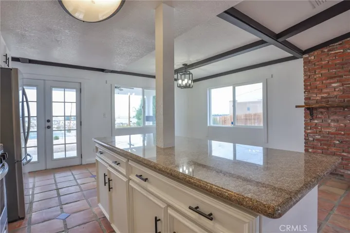 Kitchen island with view of Dining area