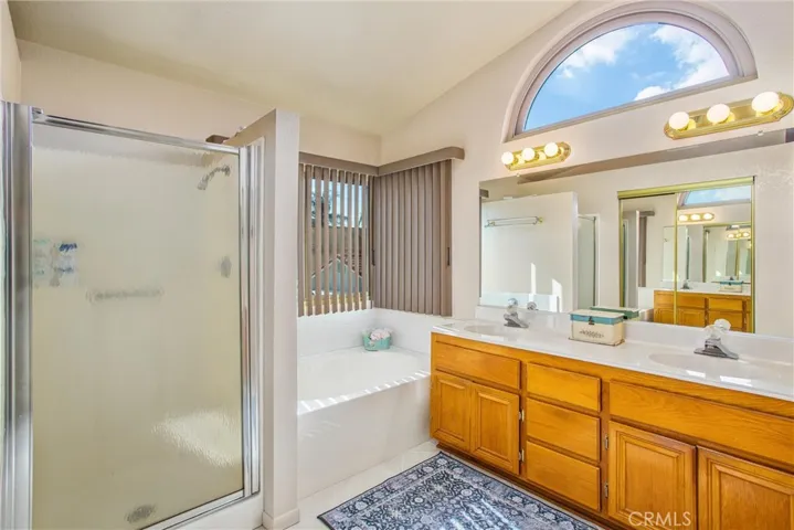 Master Bathroom with dual sinks and separate tub & shower