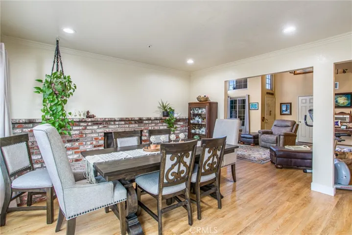 Family Room with Fireplace currently being used as a dining area for the large family