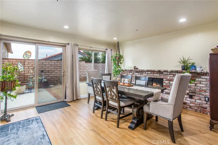 Family Room with Fireplace currently being used as a dining area for the large family