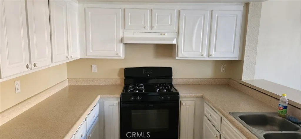 Nice kitchen with fresh painted cabinets.