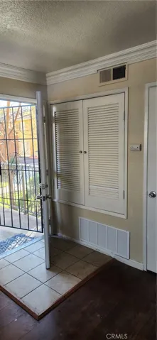 View toward front entry with large coat closet.