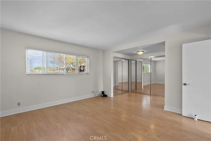 Master bedroom with full closet mirror doors