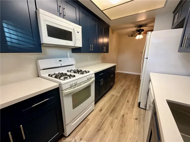 Kitchen with built-in microwave over free-standing range (gas oven/cooktop)