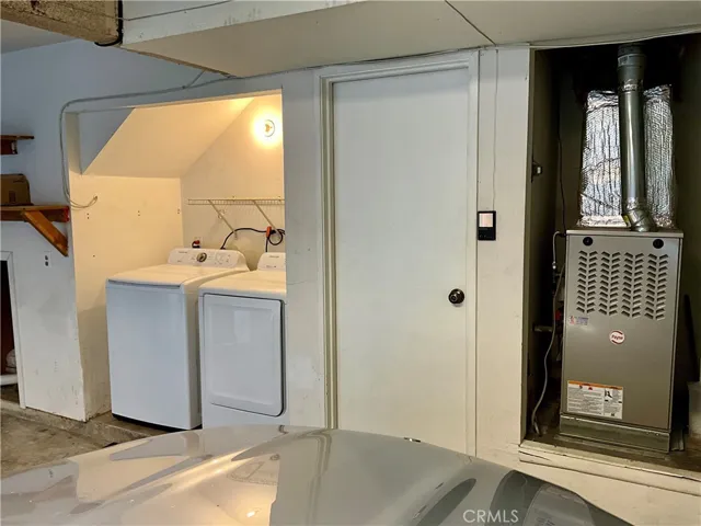 2-Car Attached Garage with new forced air unit (natural gas heater) and laundry area