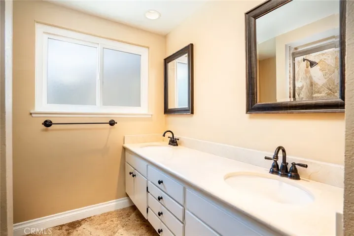 Upstairs hall bathroom, dual vanity.