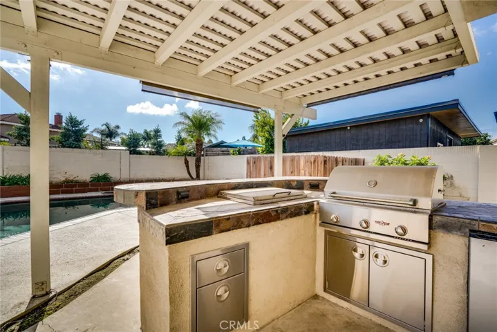 Built in BBQ with tile countertop, stainless steel.
