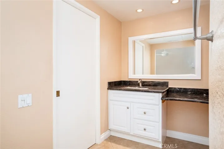 Upstairs primary bathroom, additional closet on side.