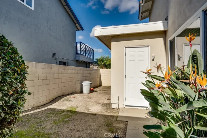 Garage door access on side yard.