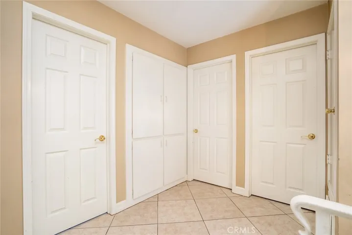 Upstairs bathroom door, storage, two bedroom doors.