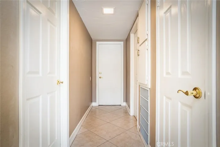 Downstairs hall to garage, bedroom, bath.