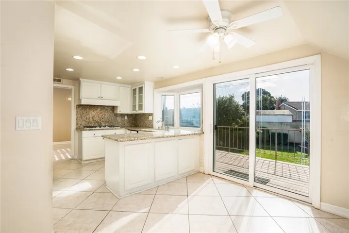 Kitchen with slider to deck.
