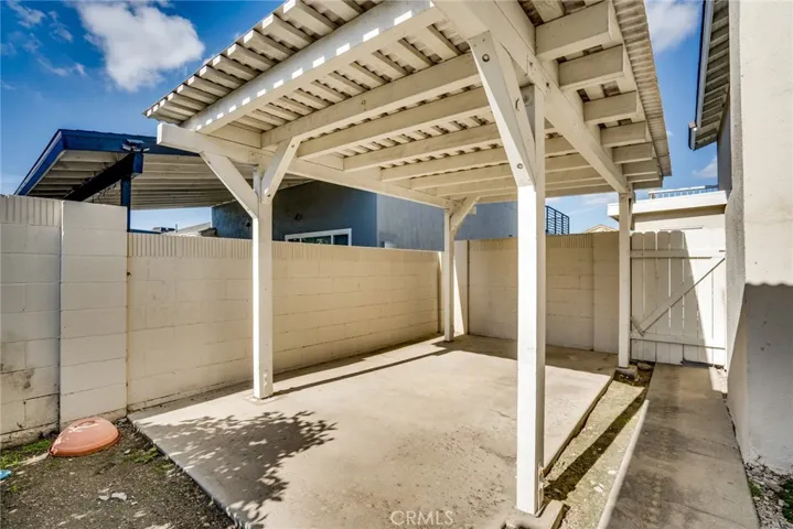 Side yard, additional covered patio.