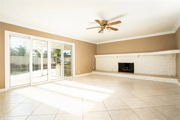 Family room with fireplace, slider to back.