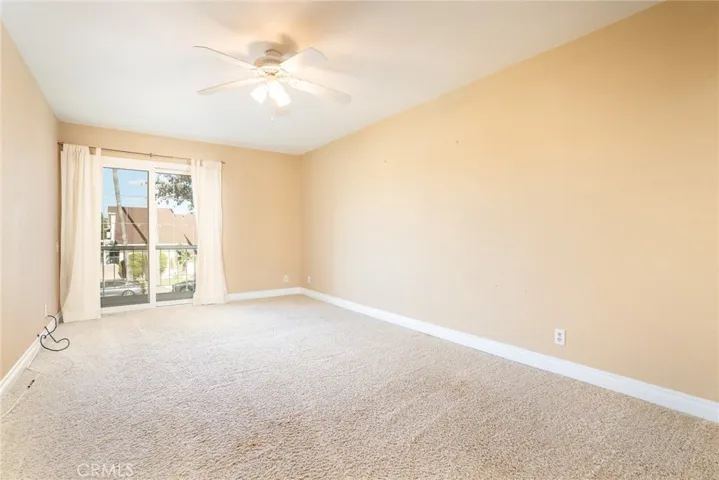 Upstairs bedroom with slider to balcony.