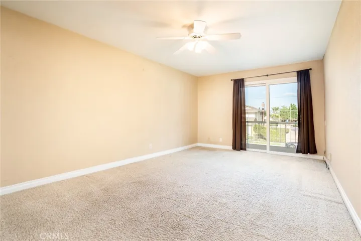 Upstairs bedroom with slider to balcony.