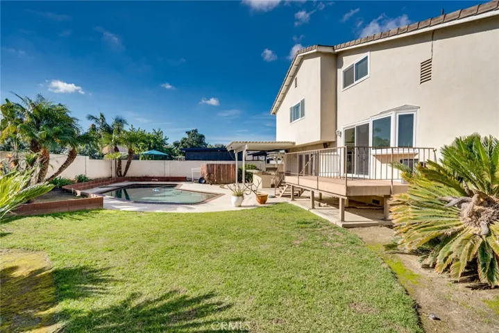 Large grass area in backyard, 8,500 square foot lot on property.