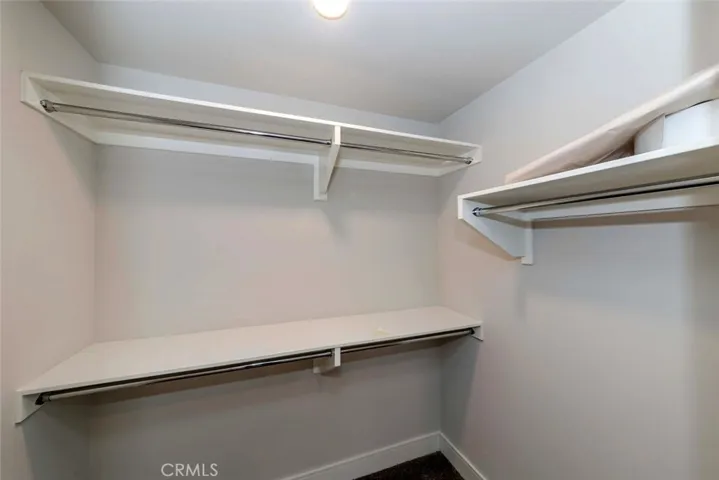 Walk in closet  in primary bedroom suite