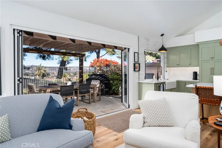 Indoor / outdoor California living with stunning custom doors that open to the backyard with views of the San Juan Capistrano Valley