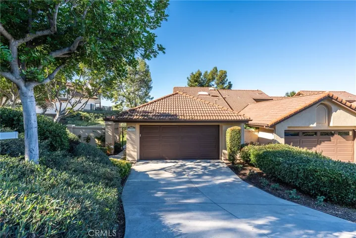 Ample parking on the extra long driveway, leading to the 2 car garage.