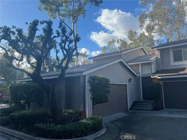 Corner unit showing garage and front door