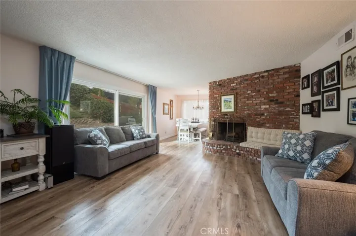 FORMAL LIVING ROOM WITH WOOD BURNING FIREPLACE
