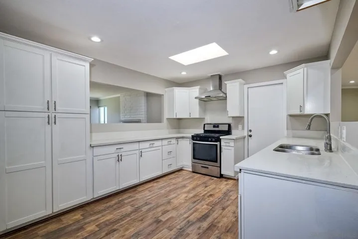SPACIOUS KITCHEN! - DOOR LEADS TO 2-CAR GARAGE....
