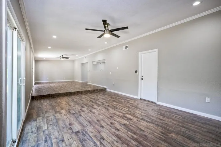 EXTRA LARGE FAMILY ROOM WITH ACCESS TOWARDS 2-CAR GARAGE...